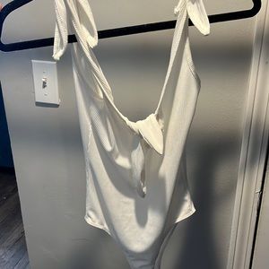 Clean white tie front bodysuit